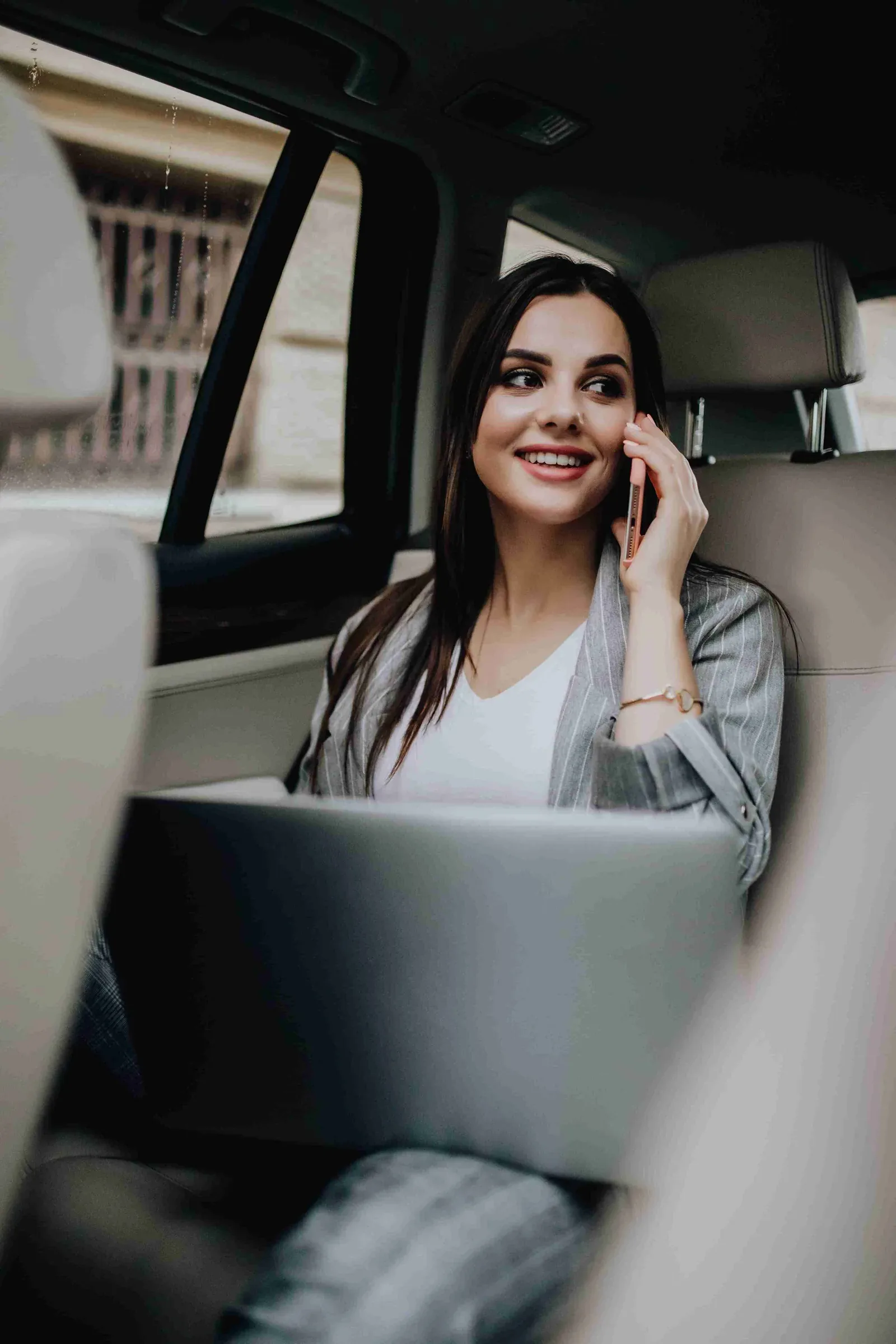 Passenger working from the back seat of a Blackdoor Limo
